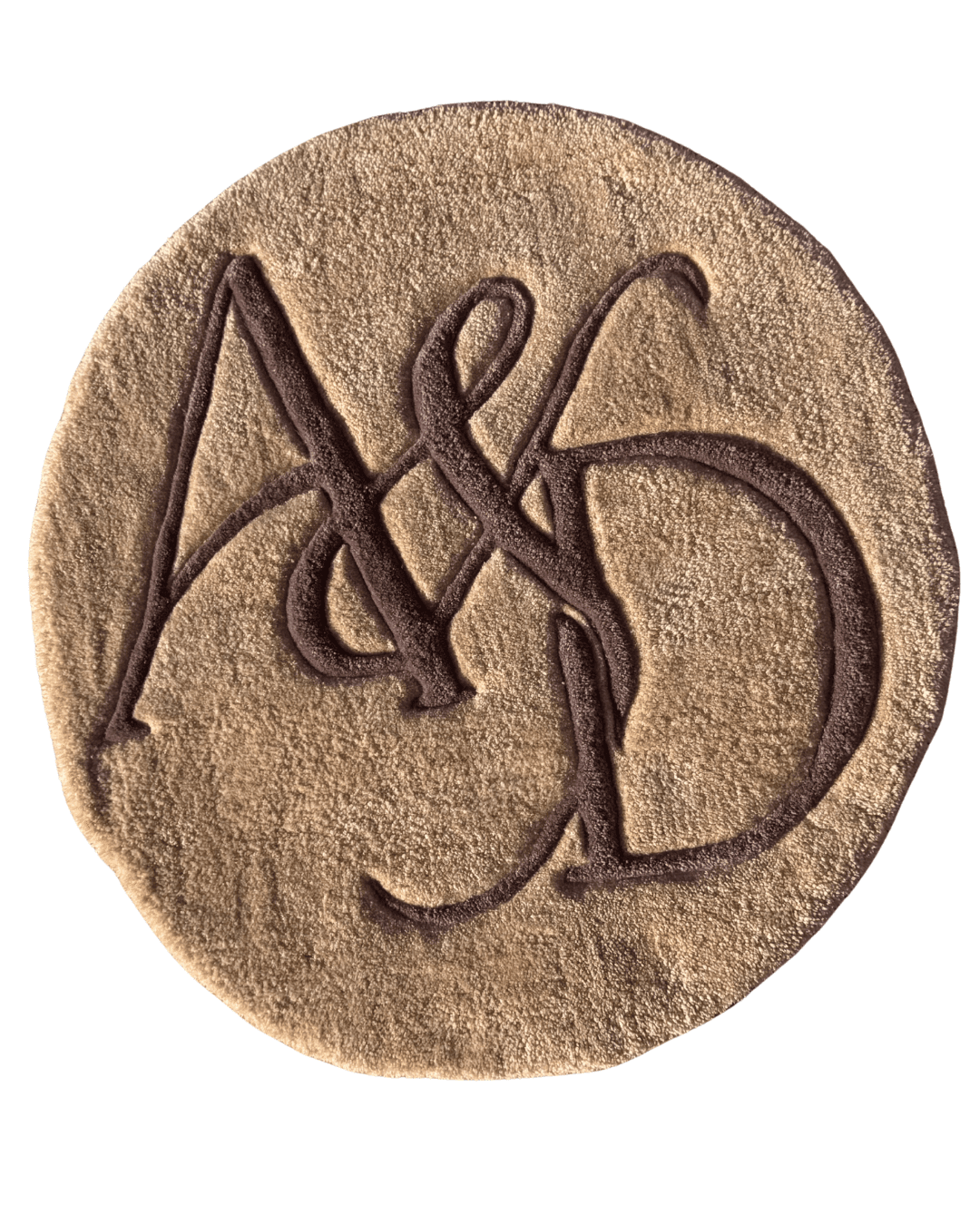 This is a round, custom hand-tufted monogram rug with an elegant, minimalist look. It features intertwined “A & D” initials in a flowing, calligraphy-inspired style, tufted in a deep chocolate brown over a warm beige/cream background.
The lettering is carved and slightly raised, giving the monogram a beautiful 3D textured effect while keeping the overall design clean and sophisticated. The overlapping lines of the initials create a romantic, personalized feel, while the neutral earthy color palette makes it timeless and easy to style.